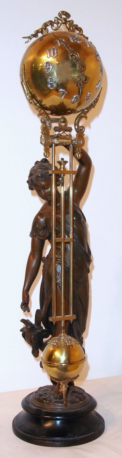 Ansonia Clock Co., Ansonia, Conn. "Huntress Ball Swing" with 8 day time only spring driven movement in Barbedienne finished ball case supported by bronze finished statue, c1901 — Antique Clocks Price Guide