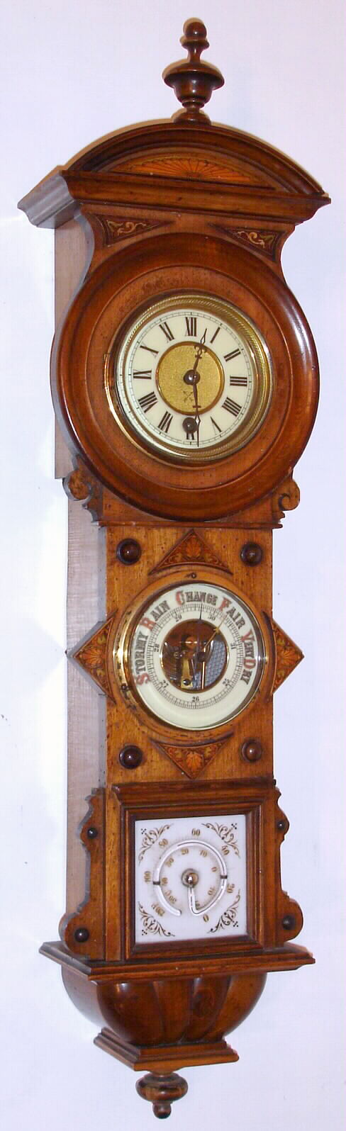 Junghans, German, wall clock with 8 day time only spring driven pendulum movement in walnut case with ornately inlaid decorations with mercury thermometer and aneroid barometer, c1900 — Antique Clocks Price Guide