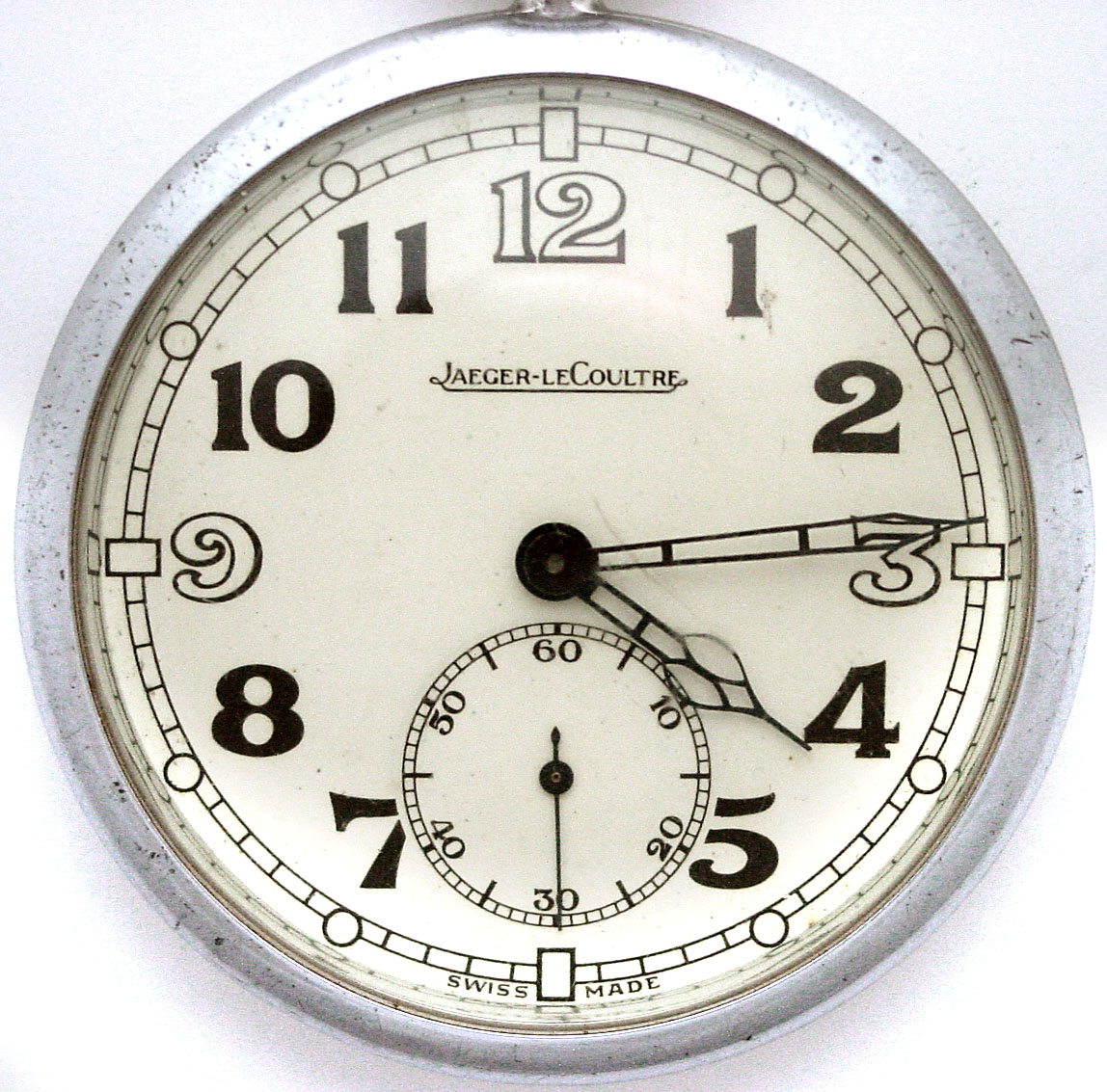 Jaeger LeCoultre Switzerland military model stem wind pendant set gold flashed movement with lever escapement and gold flashed balance in base metal snap back and bezel open face case with Arabic numeral metal dial and fancy hands, serial No. 46712 in wooden shipping case with replaced bottom — Antique Clocks Price Guide