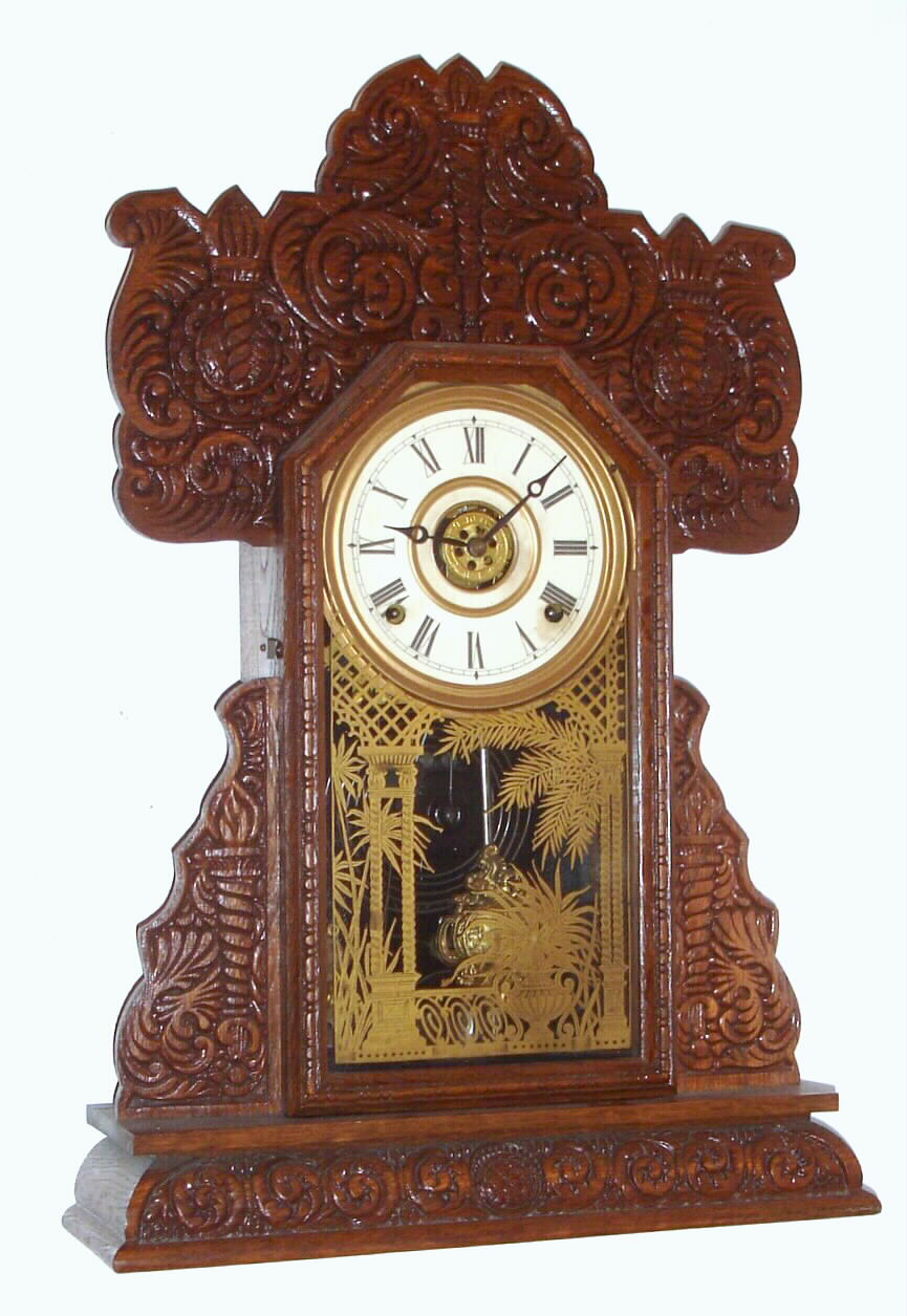 E. Ingraham and Co., Bristol, Conn., "Torchlight Series", 8-day time/strike oak parlor clock made expressly for the Belknap Hardware and Mfg. Co., Louisville, KY. This is a sales premium clock not seen in the Ingraham catalogs, C. 1895 — Antique Clocks Price Guide