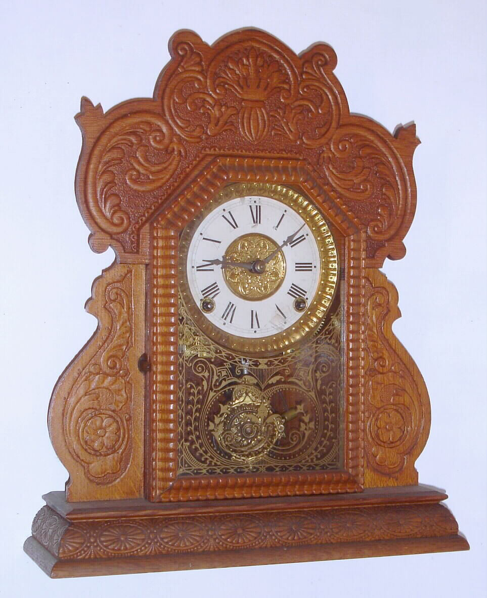 E.N. Welch Mfg. Co., Forestville, Conn., C. 1895, "Cabinet K., No. 6", 8-day time/strike pressed oak case shelf clock. — Antique Clocks Price Guide