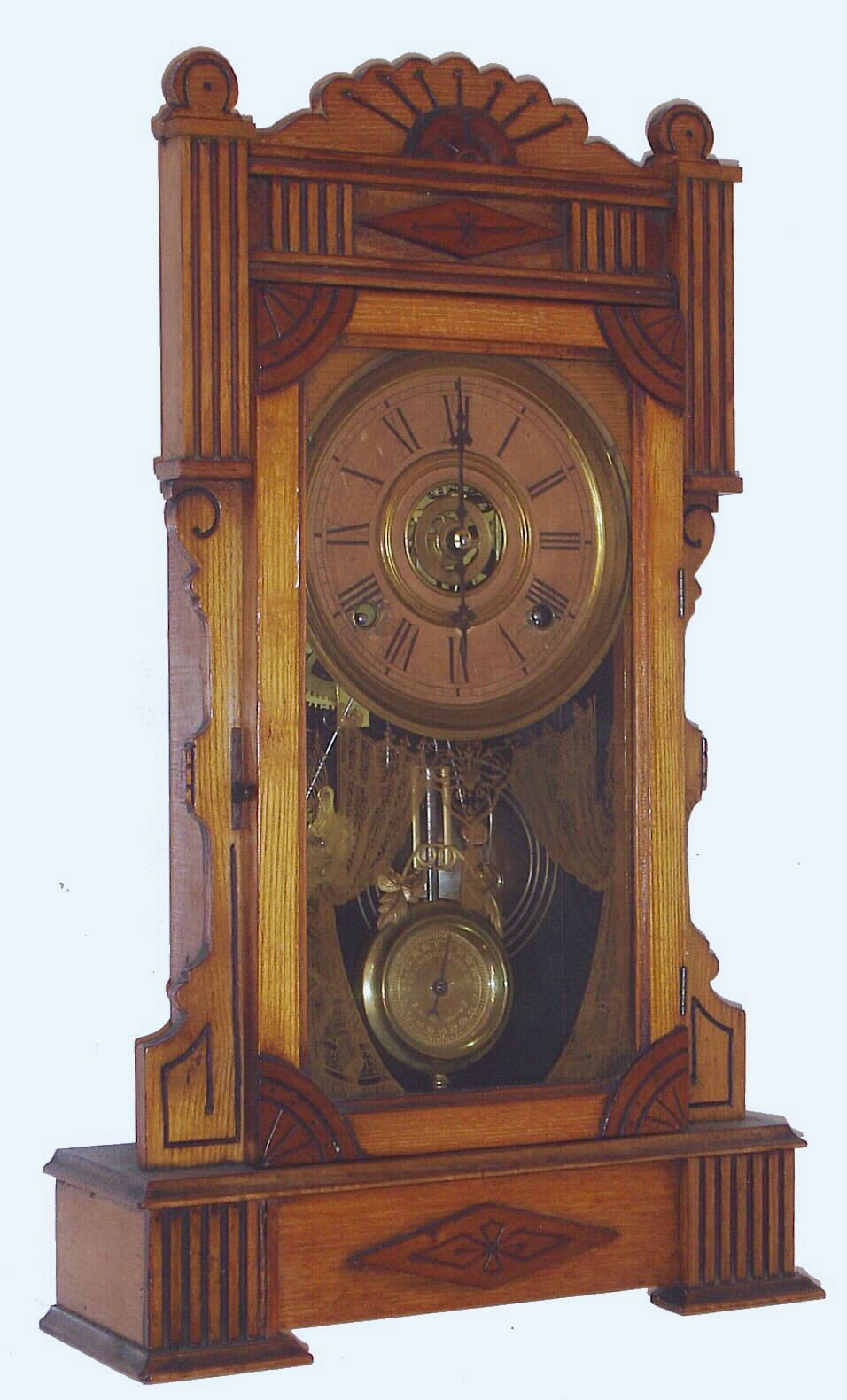 William L. Gilbert Clock Co., Winsted, Conn., C. 1885, "Calpe", 8-day time/strike/alarm ash and walnut mantel clock. — Antique Clocks Price Guide