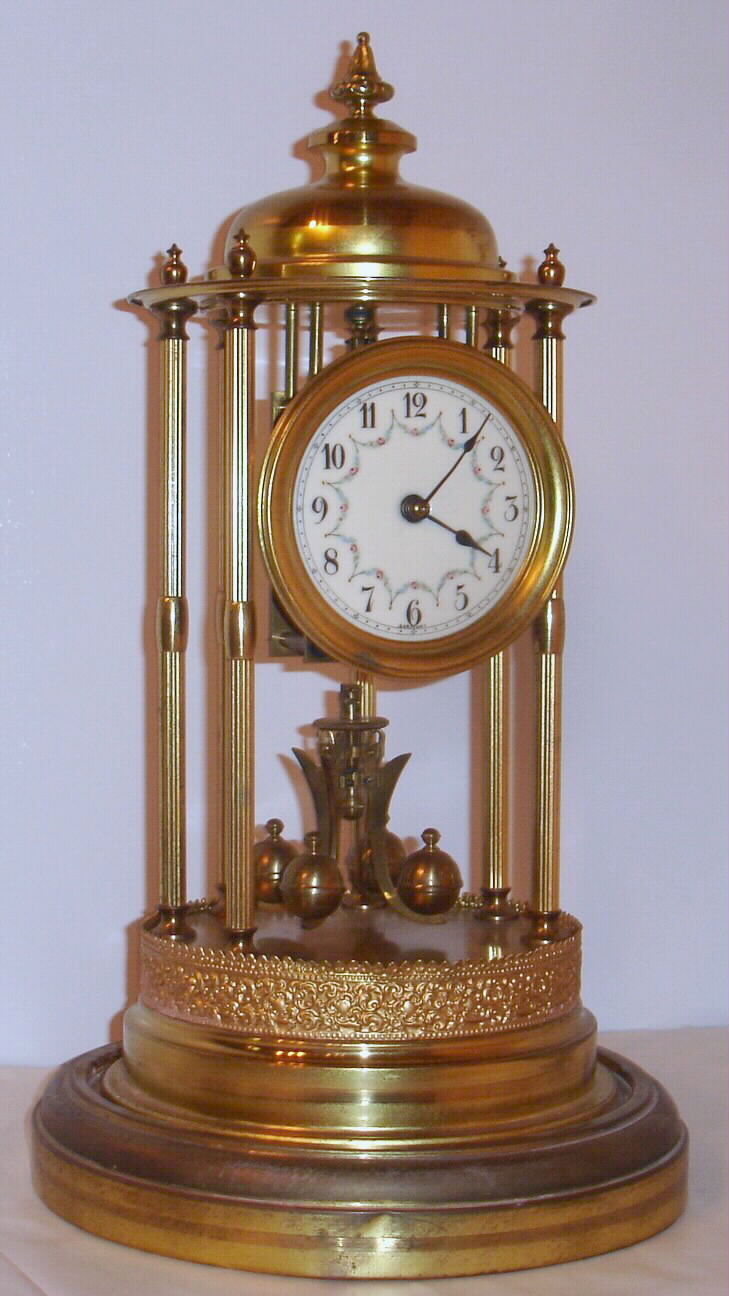 German, Socol Montag and Co., C.1930, 400-day, 4-ball rotary pendulum, torsion timepiece under a dome, Louvre model. Horolovar's 400-day repair guide examples are shown as "Sokol Montag and Co." The spelling may have changed for the English market. — Antique Clocks Price Guide