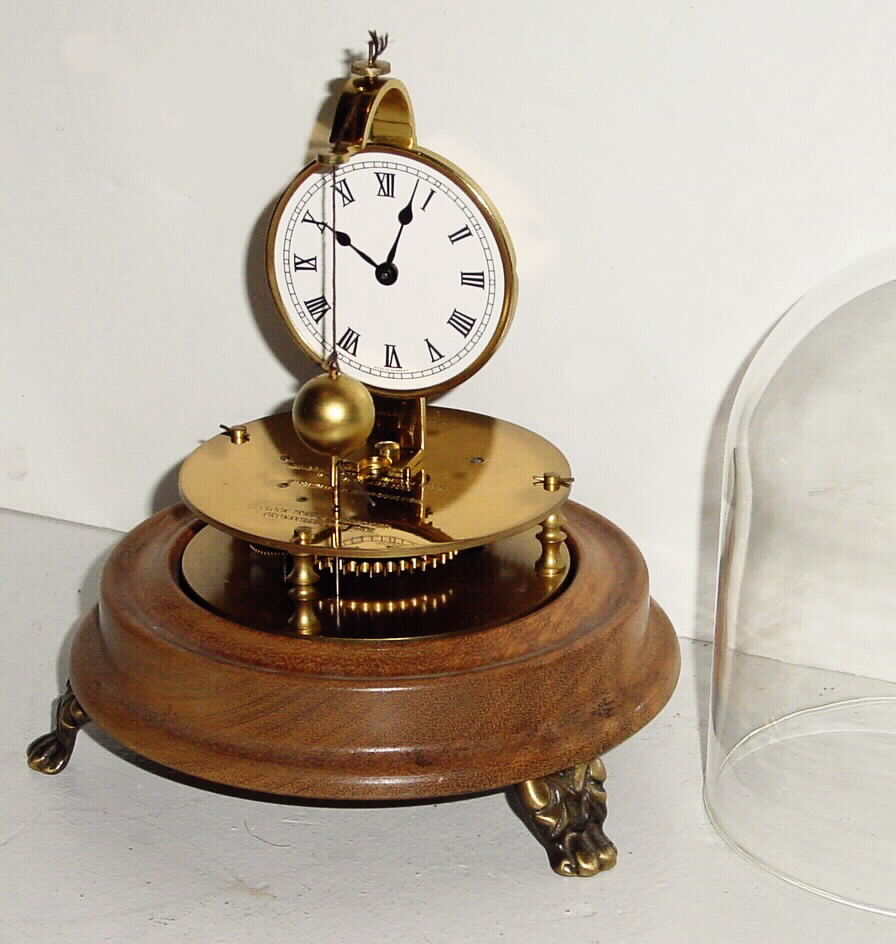 Horolovar Co., NY, C. 1975, repro of the Briggs rotary pendulum timepiece, 8-day, bottom wind with glass dome. — Antique Clocks Price Guide