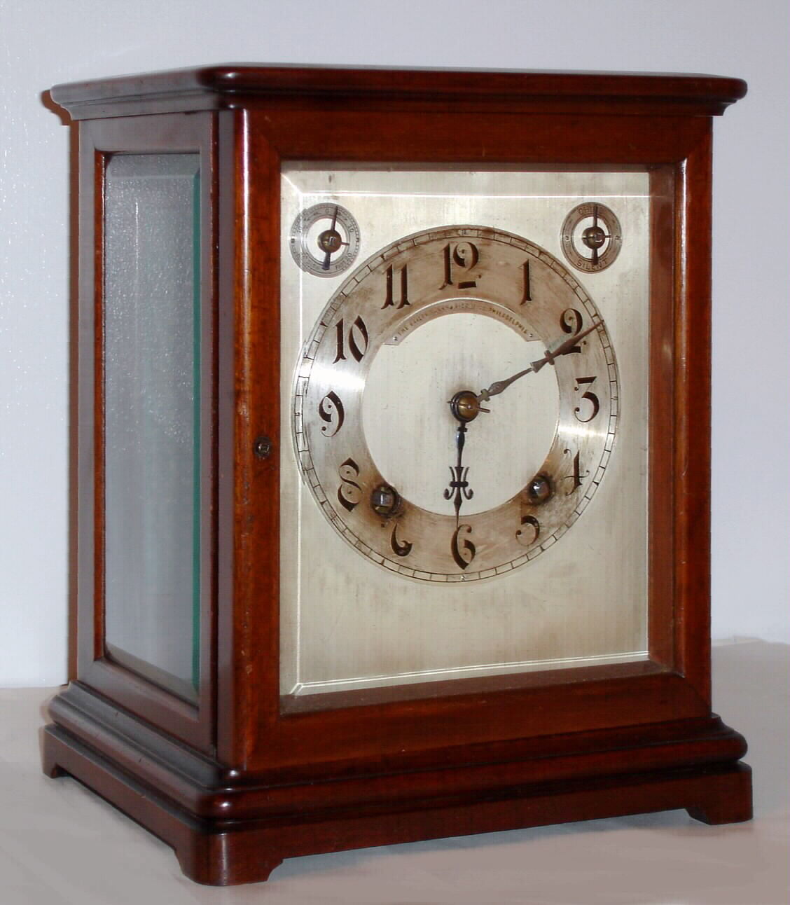German, Winterhalder and Hofmeier, 8-day time and quarter striking on two gongs (bim-bam), wood and glass mantel clock retailed by Bailey, Banks and Biddle, Philadelphia. — Antique Clocks Price Guide