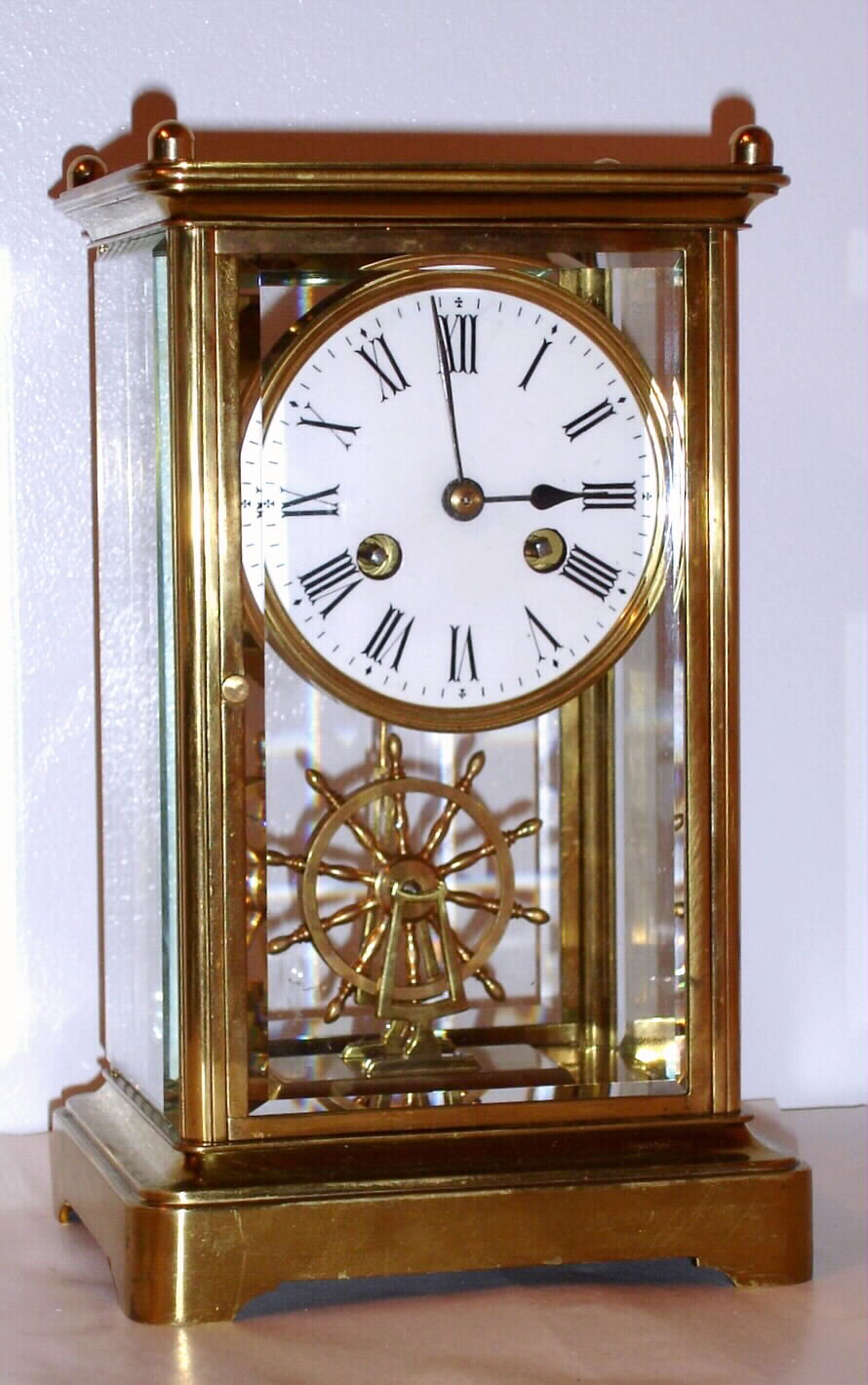 French crystal regulator mantel clock 8 day time and strike movement with ship's wheel as detached balance and Roman numeral porcelain dial, c1890 — Antique Clocks Price Guide