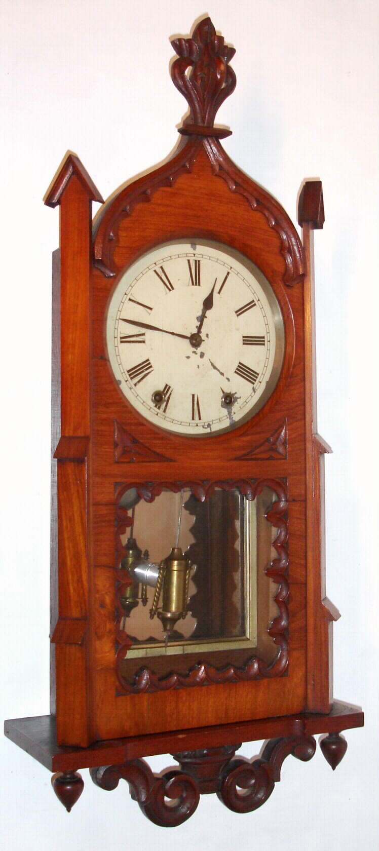 English (Anglo-American) 8-day time/strike Gothic style wall clock, with a Seth Thomas movement. Many of the cases made in England are found with a Seth Thomas, Welch, or New Haven movement. American movements were purchased by provincial case makers for a fraction of the cost of an English mov't, C. 1880 — Antique Clocks Price Guide