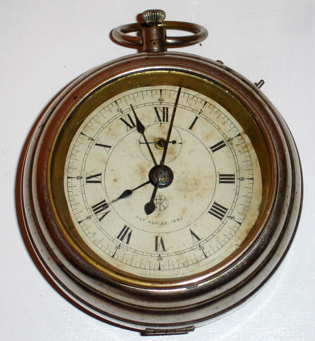 F. Kroeber Clock Co., New York, "Grandfather", 30-hour timepiece in the form of a large watch. This was the inexpensive chronograph for the millions with sweep center seconds and quarter seconds with a means to stop the movement, C. 1885 — Antique Clocks Price Guide