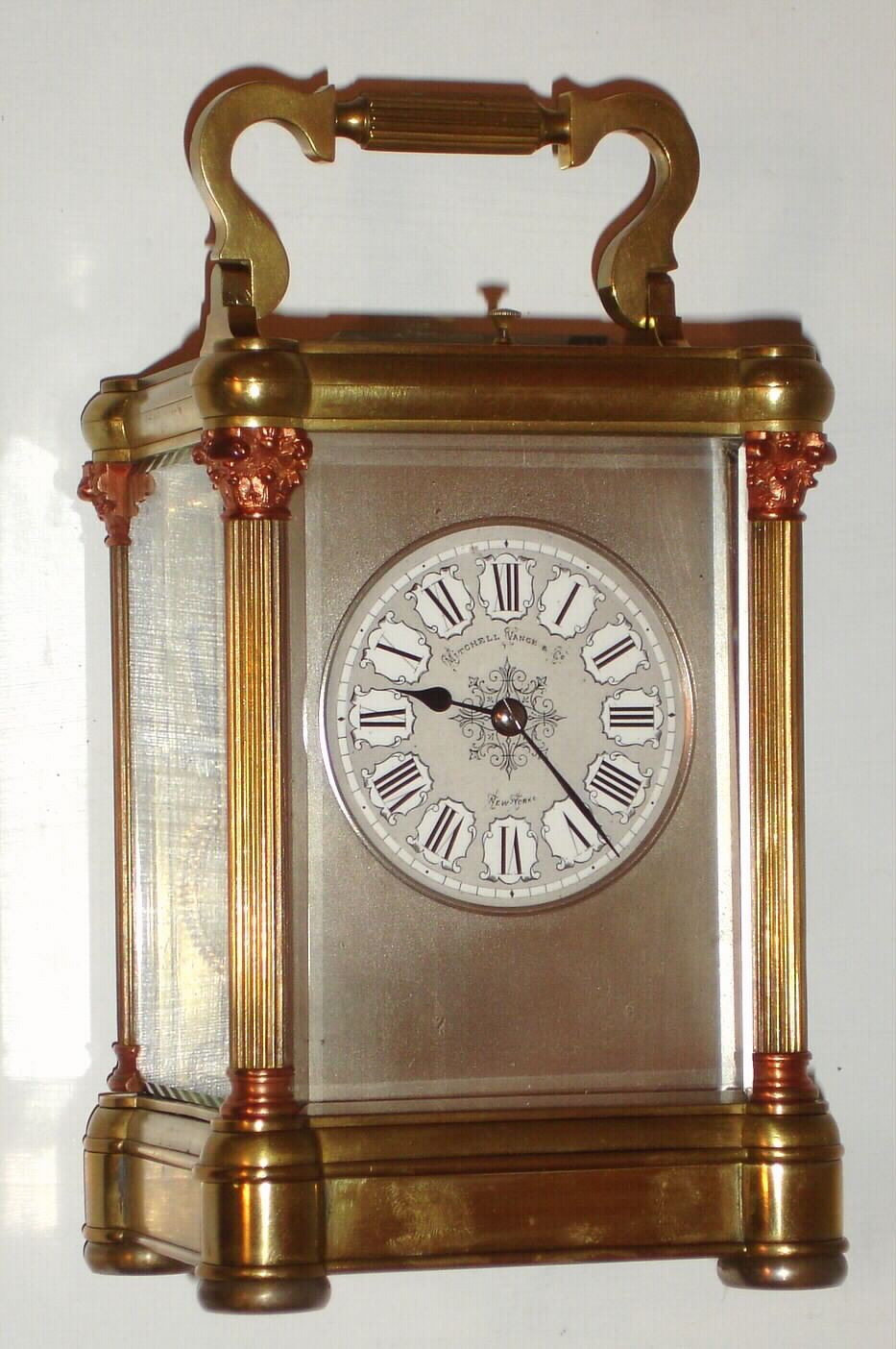 French, brass cased carriage clock, time, gong strike with repeat in column case with contrasting capitals and bases, retailed by Mitchell, Vance and Co., New York (on dial), C. 1930 — Antique Clocks Price Guide
