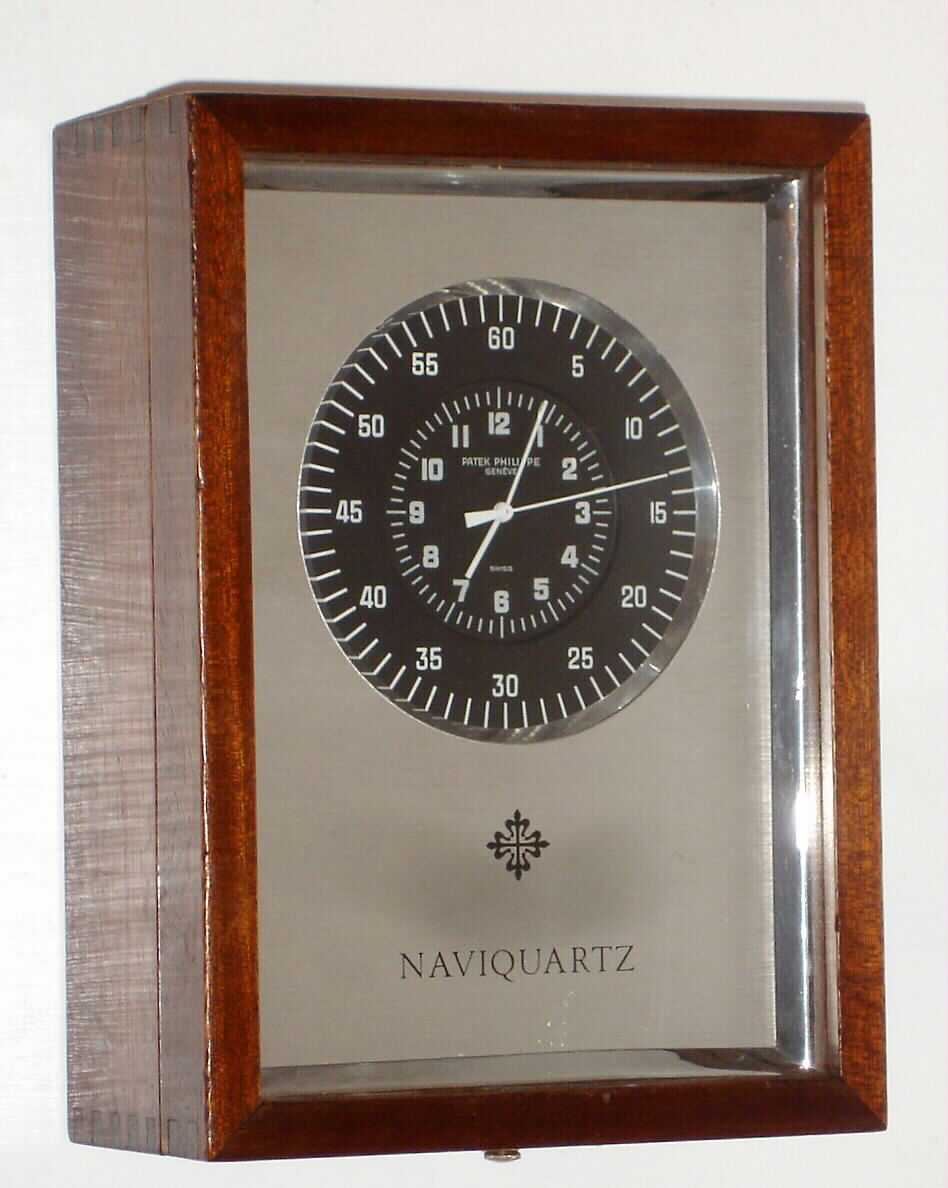 Patek Philippe, Geneva, "Naviquartz", Swiss made very high quality quartz battery operated timepiece. This was sold and serviced by the Lewis Engineering Co., Nagatuck, CT. Serial No. 690575, C. 1975 — Antique Clocks Price Guide