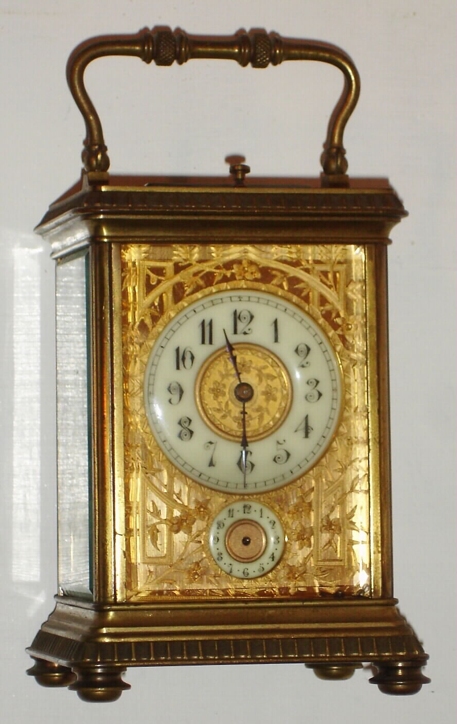 French, gilt brass case carriage clock, time, gong strike, alarm with repeat in a Corniche case with a gilt floral-trellis mask surrounding the dial (nicely pierced and chased), C. 1900 — Antique Clocks Price Guide
