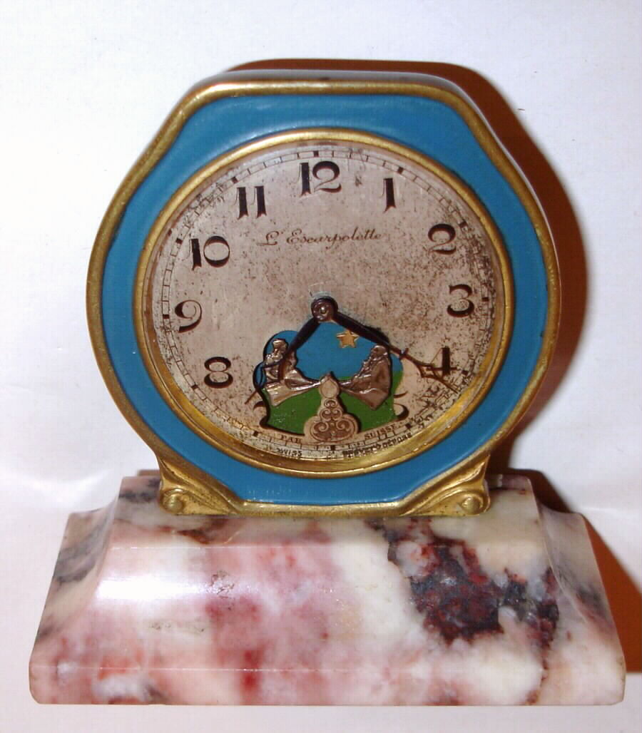 Swiss, "L Escarpolette" 30-hour watch automaton dial of two individuals on a teeter-totter set on a marble base, C. 1910 — Antique Clocks Price Guide