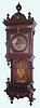 German, Lenzkirch, uncommon long wall clock with open style showing the pendulum in full view and the case with bronze trimmings, and fancy cast pendulum, c1880, serial #739569