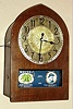 Electric Ad Clock Co., Chicago, IL, 110v, corded clock with side on-off switch, with segmented advertisements on a roller below the dial, C.1928.