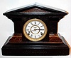 E. Ingraham, Bristol Conn. "Eclipse" Black Enameled wood 8-day time and strike mantel clock, C.1900.