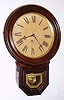 E. Ingraham Co., Bristol, Conn. "imitation rosewood" grain-painted 8-day time-only wall clock, C.1880.