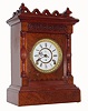 F. Kroeber Clock Co., New York, "Modena" 8 day time and strike spring driven Eclipse movement in walnut case burled front with porcelain dial, c1890