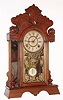 F. Kroeber Clock Co., New York "Headlight" mantel clock 8 day time and strike spring driven movement in walnut case with mirror sides, c1890