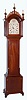Elmer O. Stennes, Weymouth, Mass., "GM1" grandmother tall case clock with 8 day Westminster chime spring driven movement by Smiths, England in Roxbury style mahogany inlaid case, with reeded quarter columns and a fretted hood, c1968.