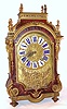Barthe Dijon, French Louis XIV Boulle type mantel clock with 8 day time and bell strike movement with crown wheel escapement. The tortoise shell veneer case is flanked by four caryatids and is profusely inlaid with brass and some silver highlights. The engraved and embossed brass dial has large enamel cartouche numerals, c1700