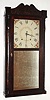 Seth Thomas, Plymouth, Conn., C. 1828 30-hour wood movement quarter column and splat shelf clock. Short pendulum movement with an early style label. Note S. Thomas produced this early long case with arched splat under full influence of the pillar and scroll, and this must be the earliest long case stenciled column he made, certainly pre-1830, and it is correct with short movement. From the collection of Chris Bailey.