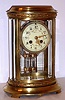 French, Marti, 8-day time and gong strike brass and glass crystal regulator retailed by Tiffany and Co, an oval case with acanthus bands surrounding the top and base, and with 2-vial compensating pendulum, C. 1900