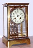 French, Japy Freres 8-day time/strike brass and glass crystal regulator, with cloisonne multicolor enamel bands top and bottom of case, on the bezel and 2 vial compensating pendulum, C. 1900