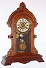 F. Kroeber Clock Co., New York, "Puritan", 8-day time/strike/alarm walnut mantel clock, C. 1878