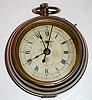 F. Kroeber Clock Co., New York, "Grandfather", 30-hour timepiece in the form of a large watch. This was the inexpensive chronograph for the millions with sweep center seconds and quarter seconds with a means to stop the movement, C. 1885