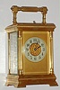 French, gilt brass carriage clock, a gilt column case with fluted corner columns, time, gong strike with repeat retailed by Bigelow, Kennard and Co., Boston, C. 1900