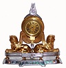 Swiss, 30-hour bar watch movement with gold balance wheel in an Art Nouveau Egyptian motif case. This was most likely a desk timepiece, C. 1920