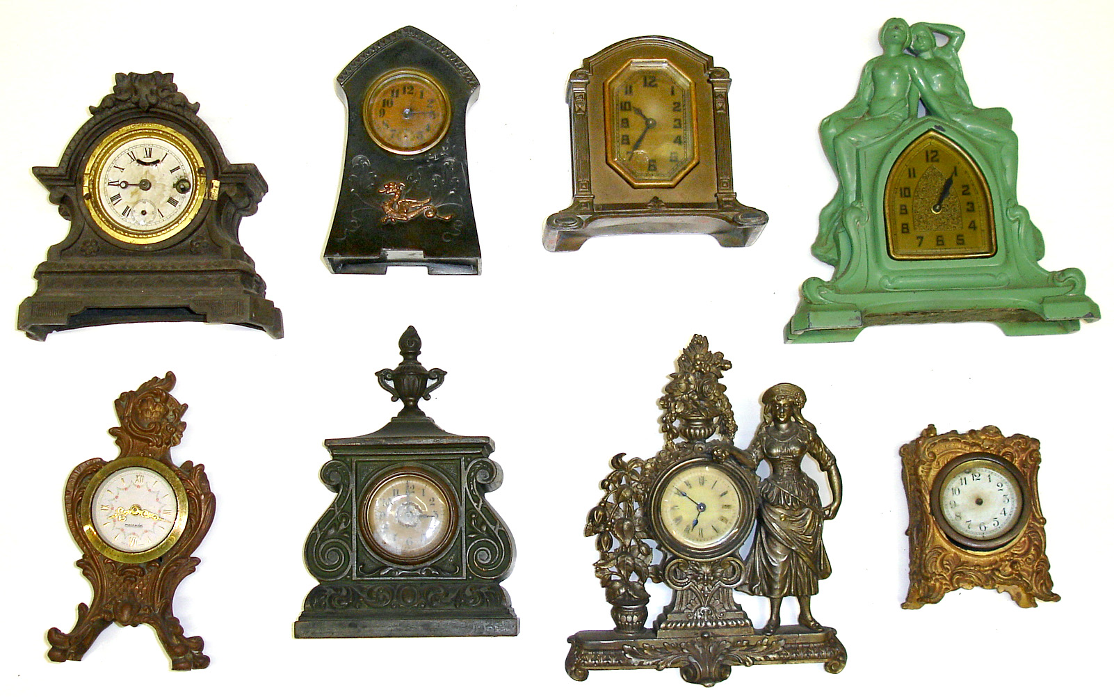 Eight cast-metal novelty clocks. Includes heavy detailed castings by Western, Waterbury, etc. — Antique Clocks Price Guide
