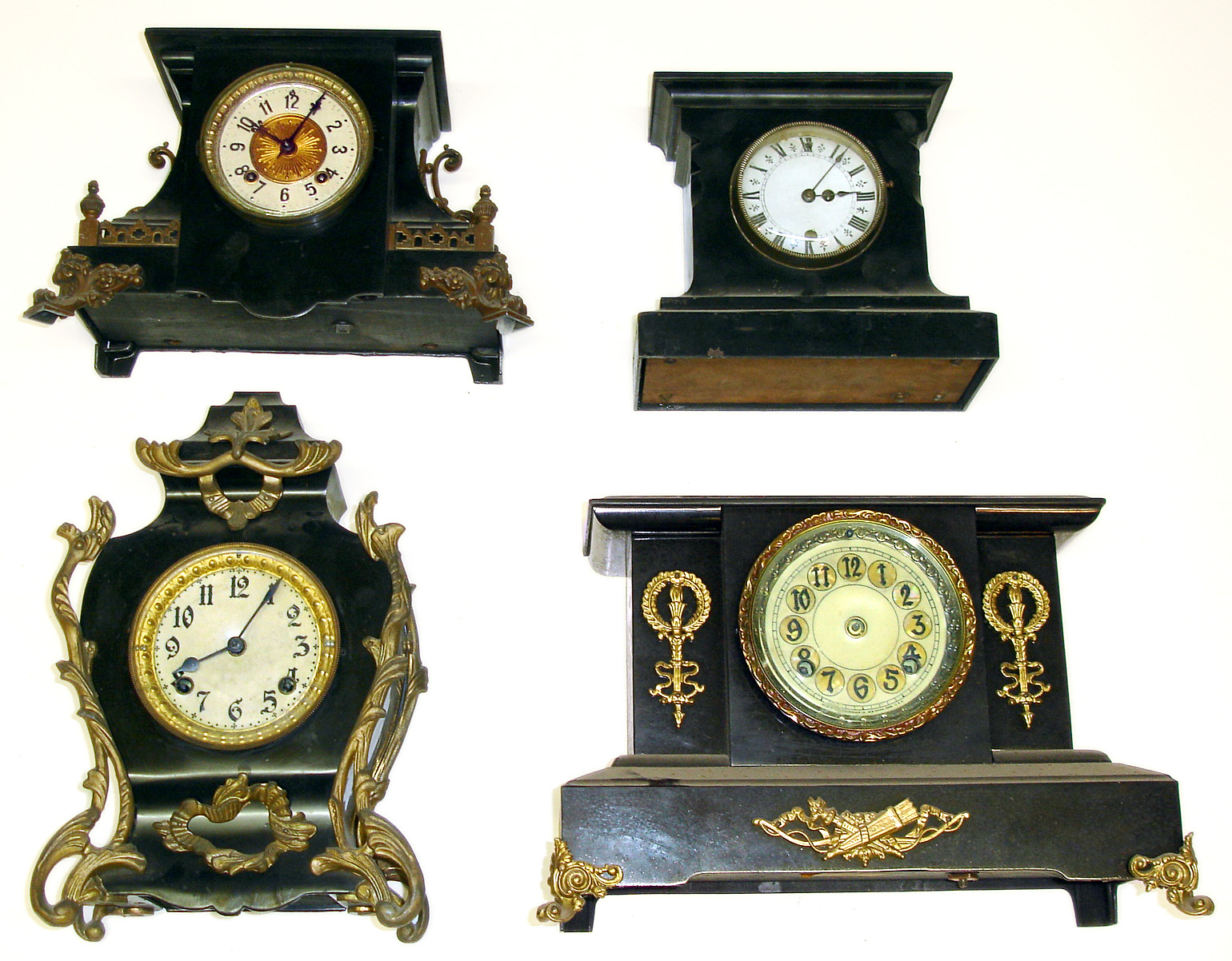 Four black iron 8-day mantel clocks. 1 Ansonia, 1 New Haven, smallest has unusual small movement with under slung strike train, tallest is 14" high. — Antique Clocks Price Guide