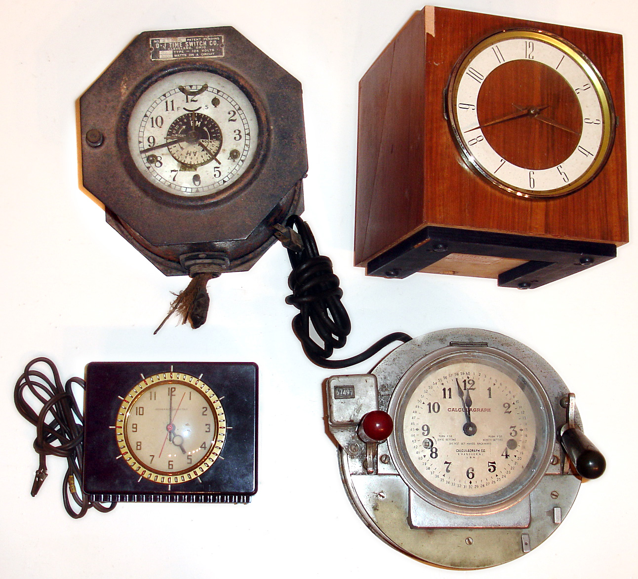 Four specialty plug in electric clocks. "Tammeter" Television Audience Measurement Ltd. (used for TV ratings). D-J Time Switch. and a Telechron appliance time switch. Also includes a Calculagraph, designed by the late William Moodie whose collection was sold at our last auction; this instrument was used to record the time of long distance phone calls. — Antique Clocks Price Guide
