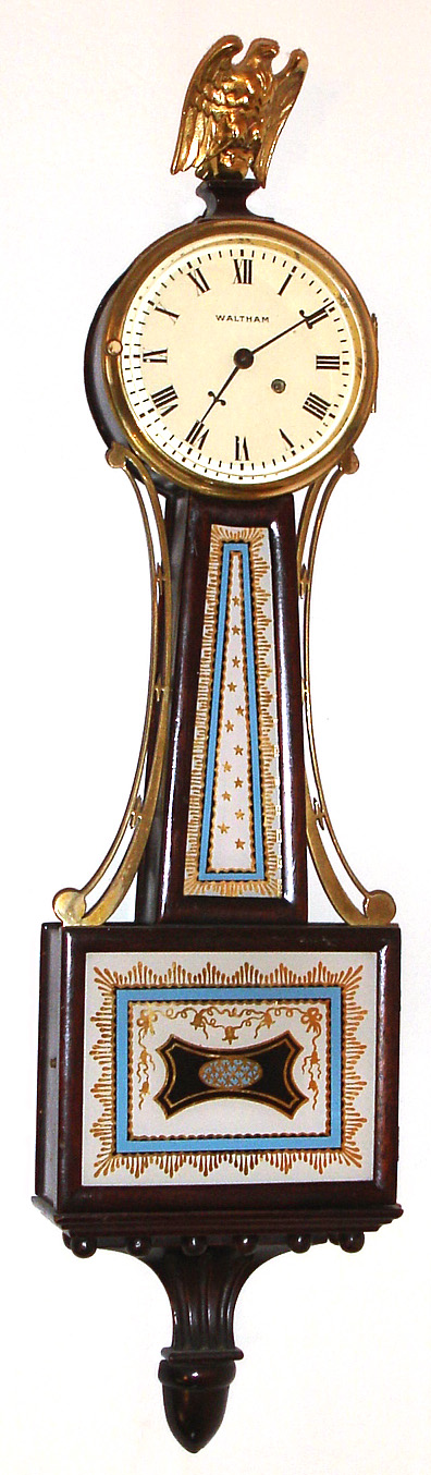 Waltham Watch Co., Waltham, Mass., miniature presentation banjo clock 15J 8 day time only spring driven movement in mahogany case with painted metal dial, c1930 — Antique Clocks Price Guide