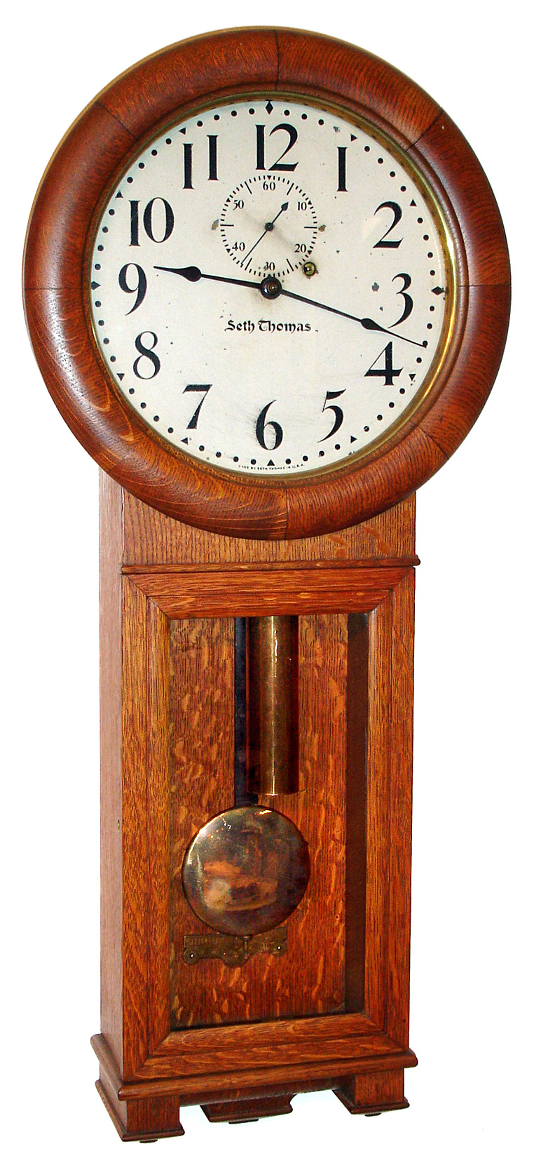 Seth Thomas Clock Co., Thomaston, Conn., "No. 2 Regulator" 8 day time only weight driven trapezoidal shaped movement stamped "77A" with painted metal dial, c1920 — Antique Clocks Price Guide