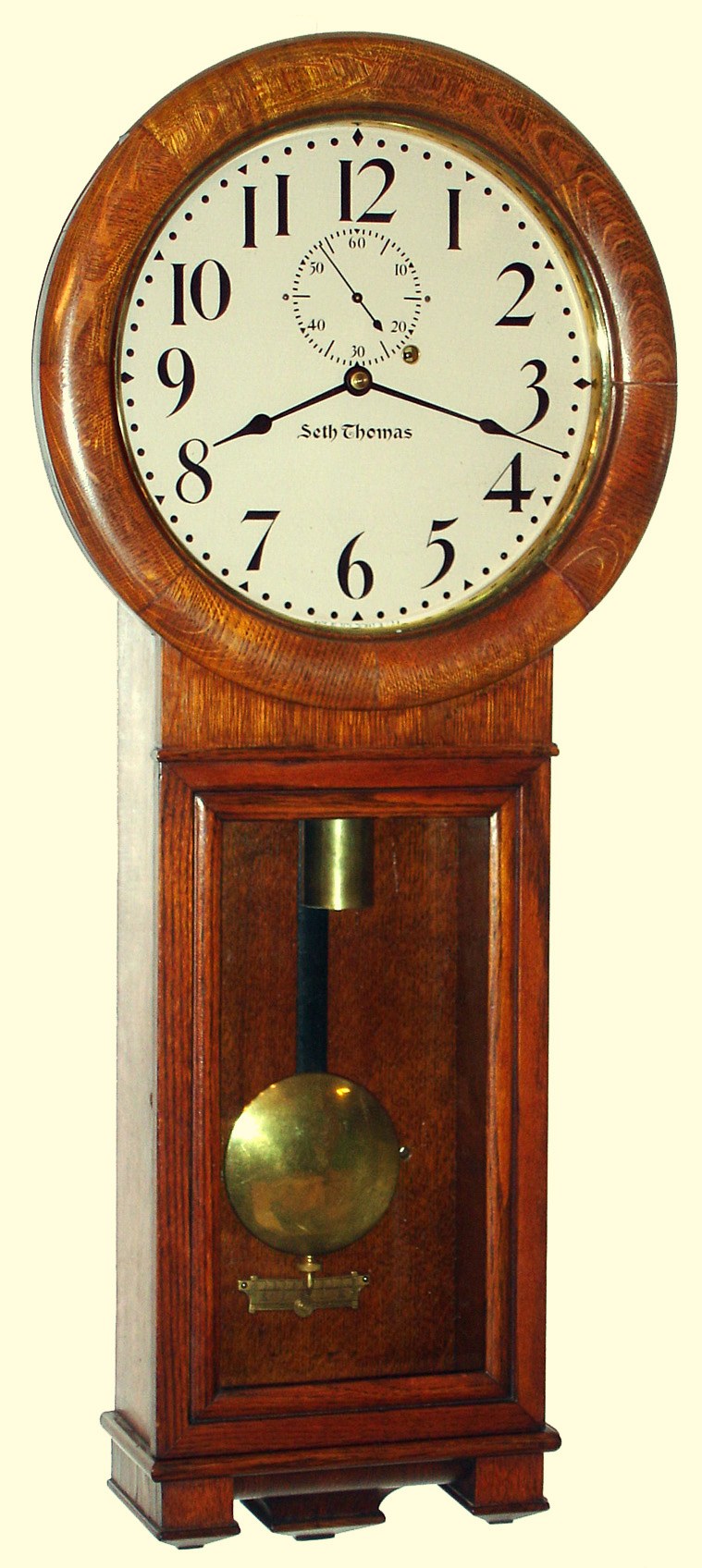 Seth Thomas Clock Co., Thomaston, Conn., "No. 2 Regulator" 8 day time only weight driven movement in oak case with painted metal dial, c1910 — Antique Clocks Price Guide