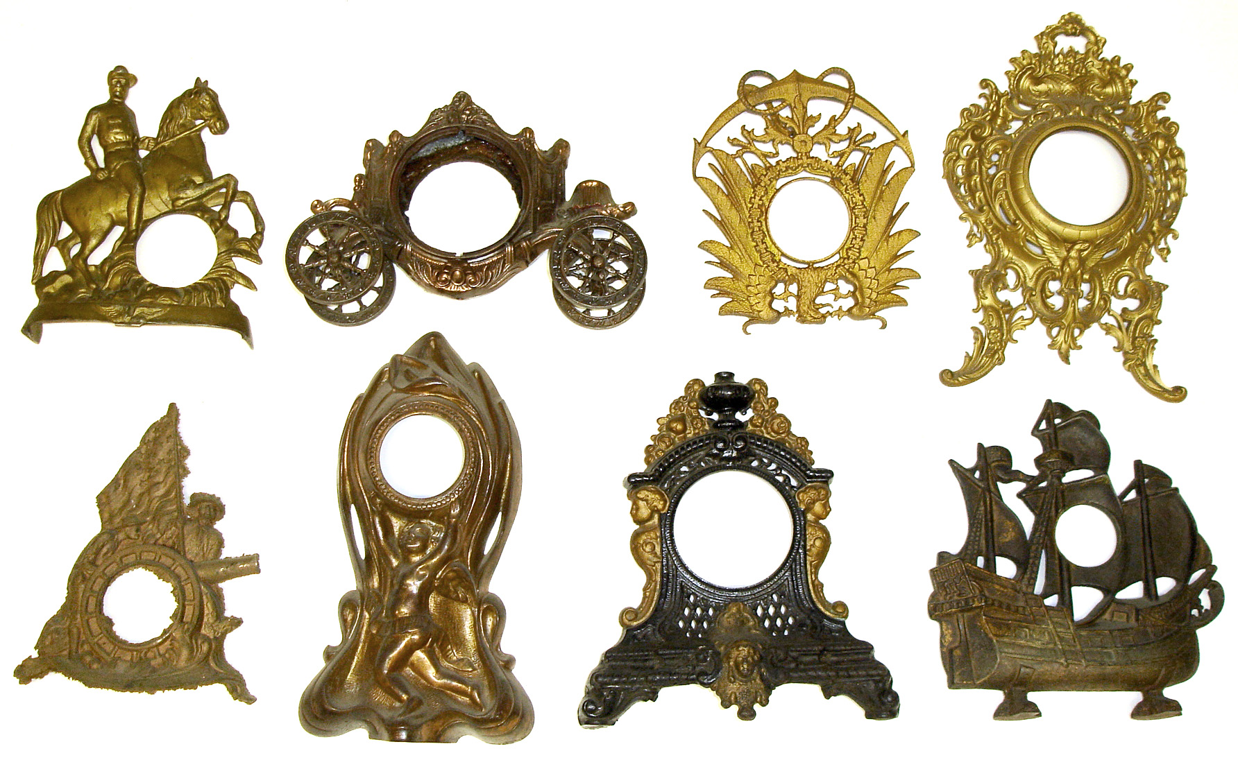 Eight cast-metal clock cases. Includes ship doorstop. — Antique Clocks Price Guide