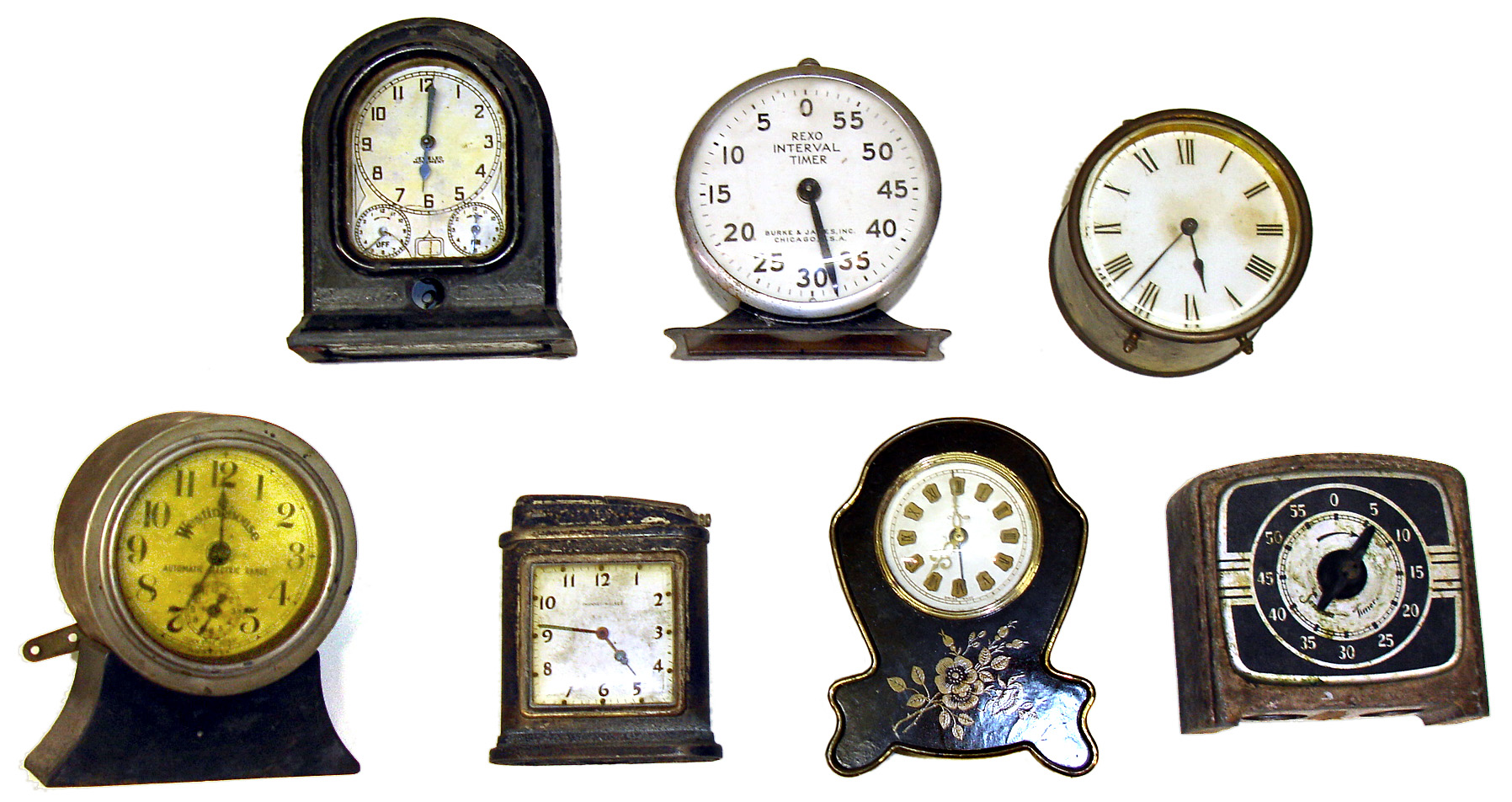 Seven small wind-up clocks and timers. Automatic range timer, Westinghouse automatic electric range, Swiss Thorens with "Auf Wiedersehen" music box, Sessions timer, Phinney Walker lighter, Rexo Interval Timer, and French brass drum clock with cylinder platform. — Antique Clocks Price Guide