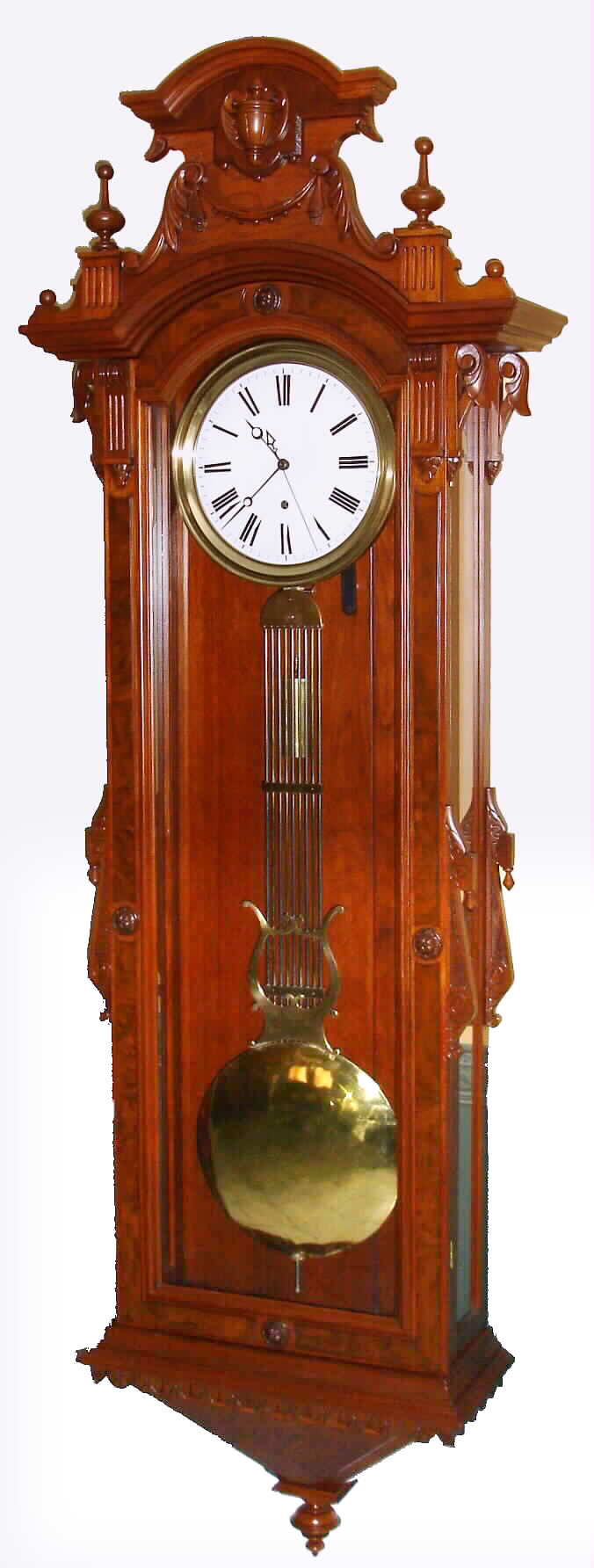 Kroeber Clock Co., New York, "Swiss Regulator No. 27" wall clock 8 day time only weight driven movement with pinwheel escapement in mahogany and burled mahogany case with porcelain dial and sweep seconds hand, c1882 — Antique Clocks Price Guide