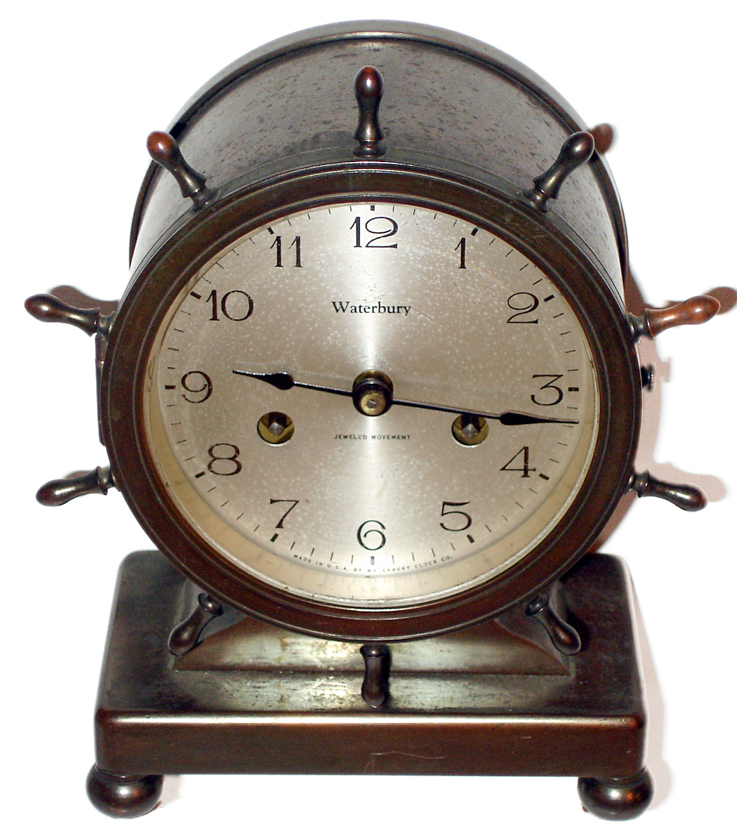 Waterbury Clock Co., Waterbury, Conn., "Pilot" mantel clock 8 day time and ship's bell strike spring driven movement in a bronze case, c1920 — Antique Clocks Price Guide