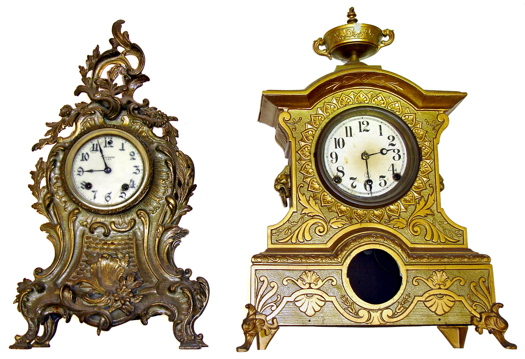 Two Connecticut heavy cast-metal 8 day mantel clocks. Shorter is New Haven with enamel dial and beveled glass. Larger gold urn top is 20" high. — Antique Clocks Price Guide
