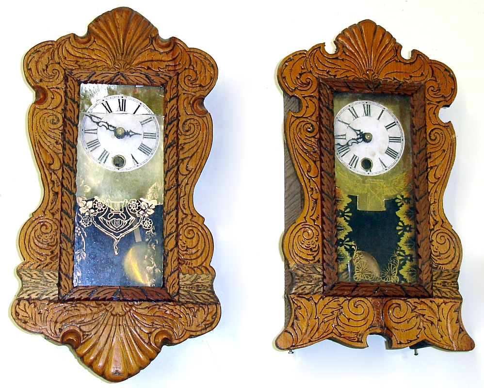Two miniature W. Paul Holland carved front clocks. One wall, one standing. Signed on backs "Original No. 1" and "Original No. 2" along with maker name. Small spring wound pendulum movements. 13" tall. — Antique Clocks Price Guide