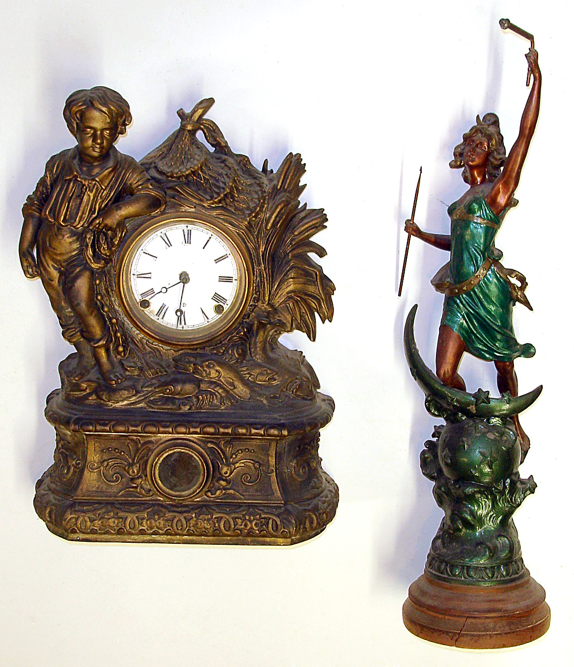 Two cast metal figurals including one complete clock and one swinger statue only, c.1880. Clock, with standing lad, fish, etc. has 8 day striking Connecticut movement and replaced paper dial. Standing spear toting lady has old green and gold paint, cracked wood base, 26" tall. — Antique Clocks Price Guide