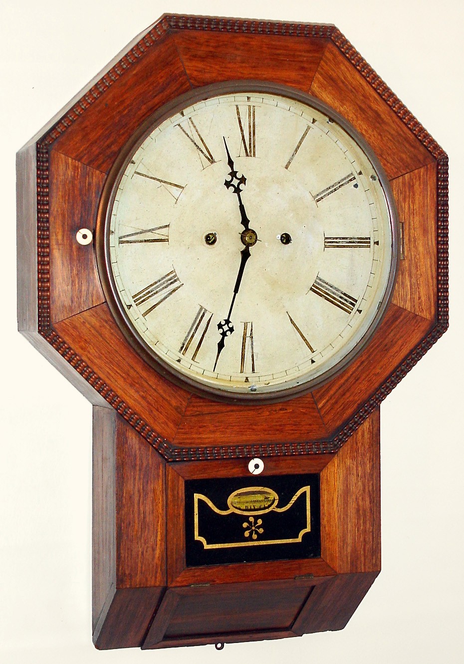 Atkins Clock Co., Equalizing Spring 30 day fusee wall timepiece, with ripple molded accents. C. 1860. — Antique Clocks Price Guide