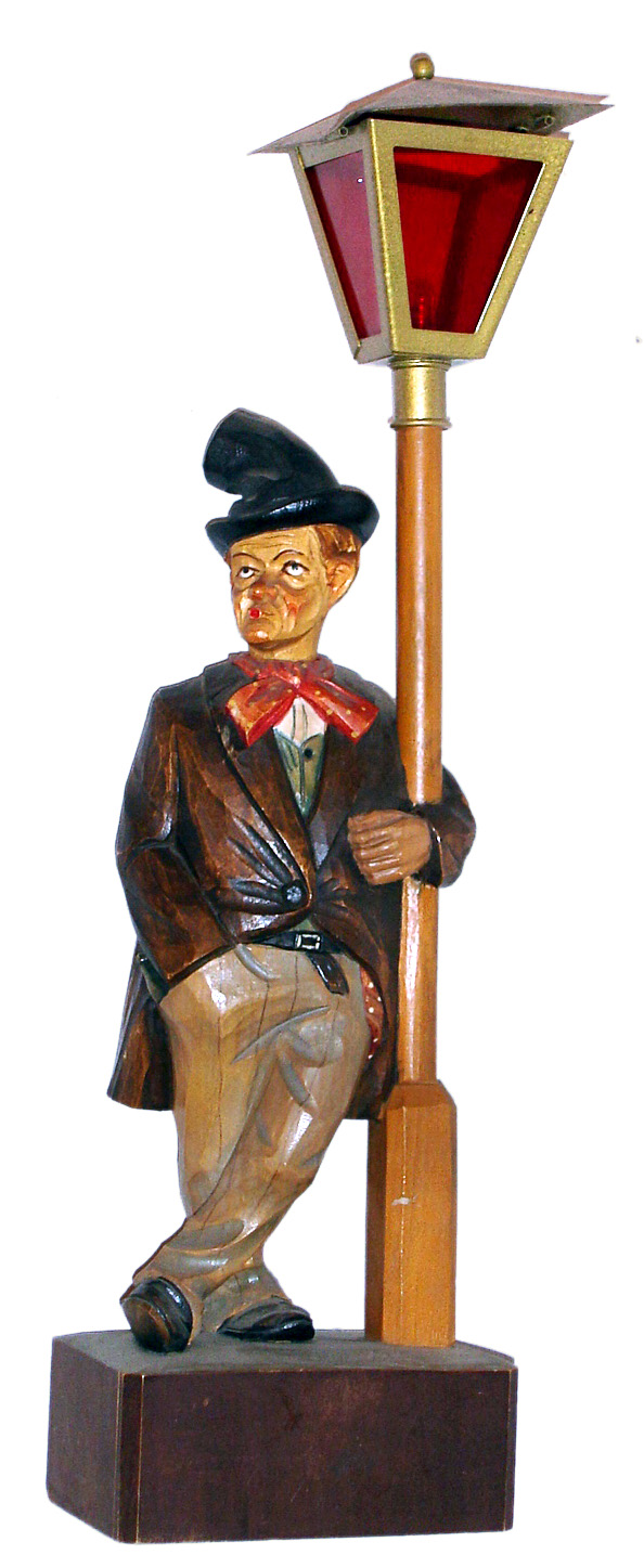 German carved and painted whistler leaning on lamppost with mechanical movement and battery powered lamp, c1930 — Antique Clocks Price Guide