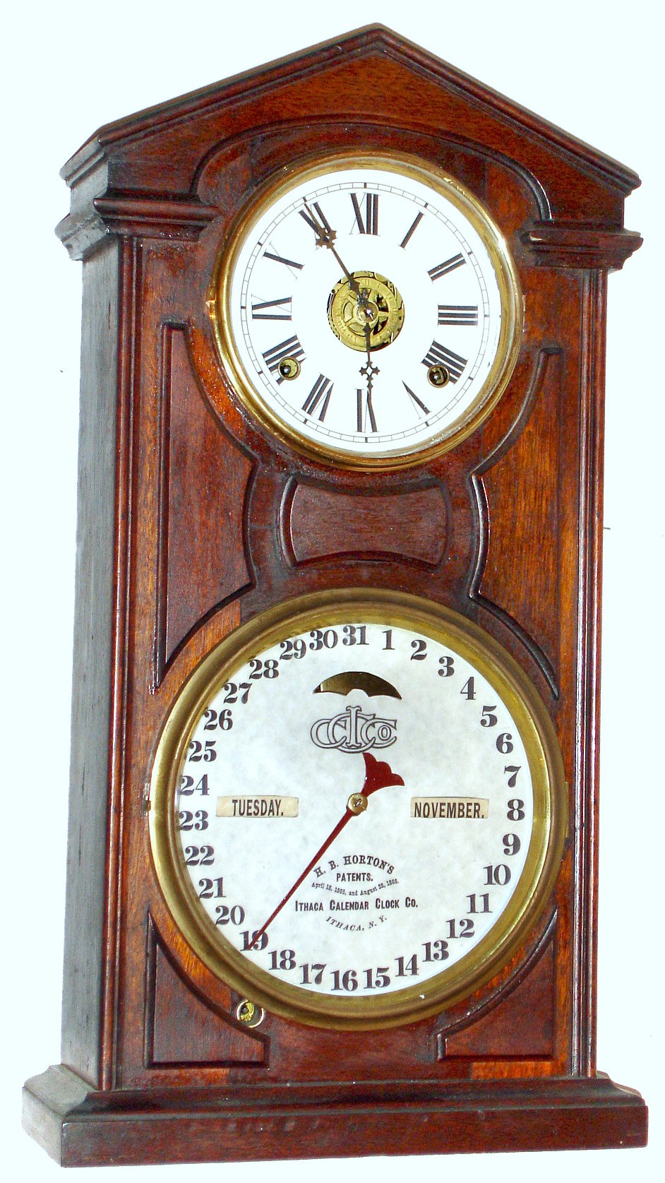 Ithaca Calendar Clock Co., Ithaca, New York "No. 7 Shelf Cottage" double dial perpetual calendar mantel clock 8 day time and strike spring driven movement with alarm in walnut case with papered metal dials, c1875 — Antique Clocks Price Guide