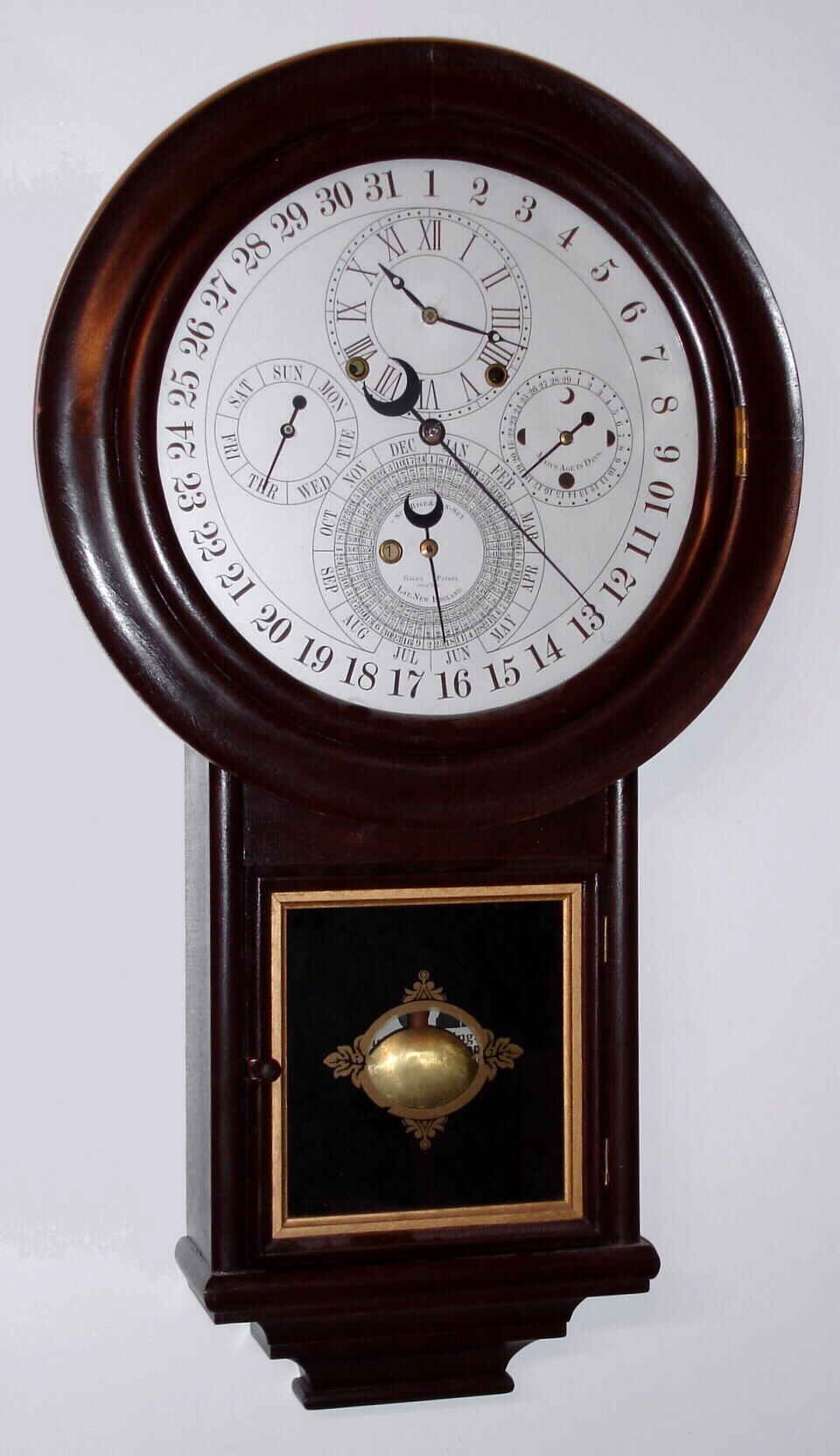 A reproduction Gale drop No. 2 wall clock with astronomical indications, C.1990. — Antique Clocks Price Guide