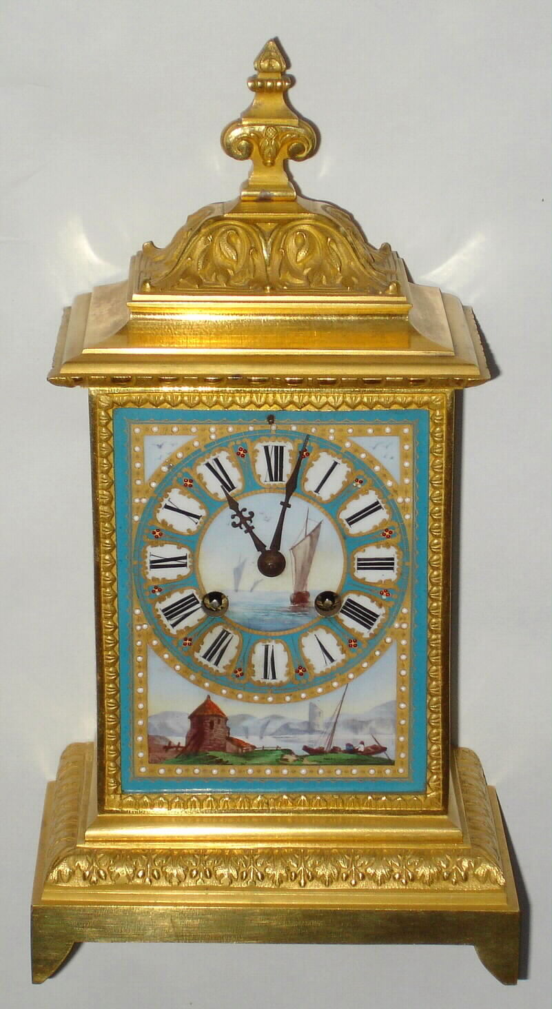 French, a desk clock with 3 porcelain panels (one with dial), bearing marine / sail boat themes, and with a bell strike movement bearing the Japy Freres logo and with pendulum regulation through the dial above 12, c1890 — Antique Clocks Price Guide