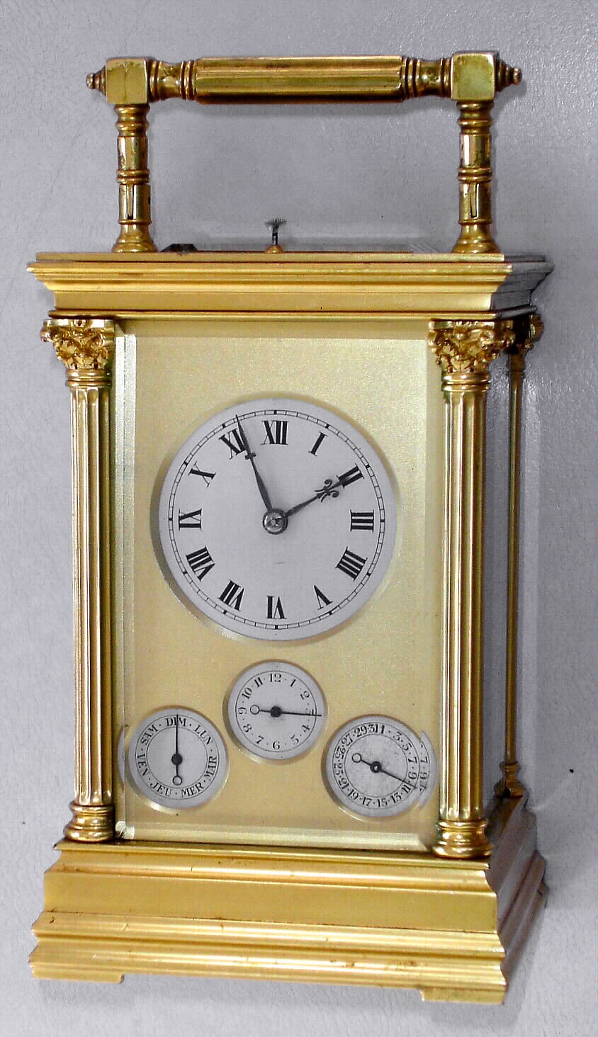French, Brass Cased Carriage Clock, (signed L.F. Paris), Grand Sonnerie with calendar and alarm in an Anglaise case with Corinthian columns. a lever on the base can select Gde Sonnerie, Silent or Quart's. Makers trademark is a shaped shield with the letters LF, and the city "Paris" showing above, serial No. 3231. We could not find this exact trademark, c1900 — Antique Clocks Price Guide
